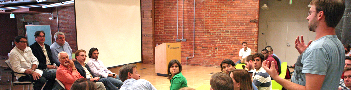 Four students collaborating on a computer